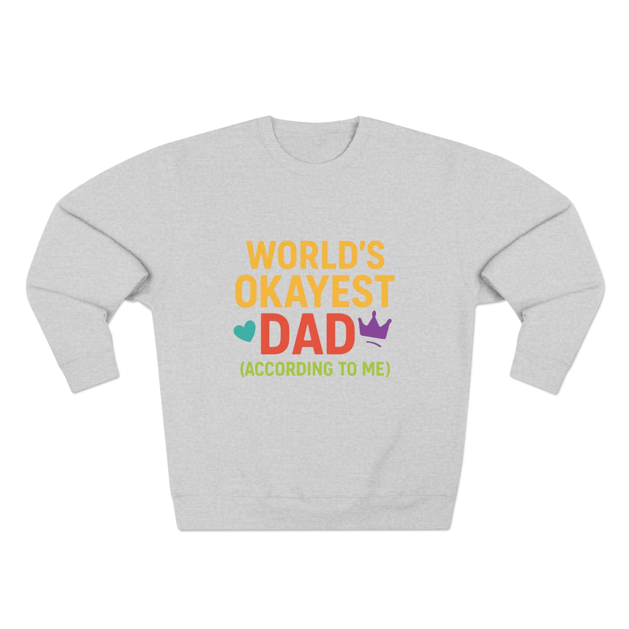 Gray sweatshirt with colorful text 'World's Okayest Dad (According to Me)' on a white background